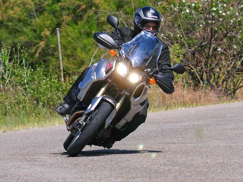 transportation, mode of transport, land vehicle, road, car, bicycle, sunlight, street, on the move, travel, riding, outdoors, day, focus on foreground, field, shadow, motorcycle, one person, stationary