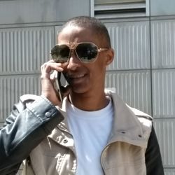 Portrait of man wearing sunglasses standing outdoors