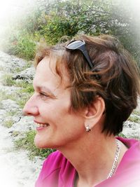 Close-up portrait of smiling woman outdoors