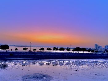 Scenic view of sea against orange sky