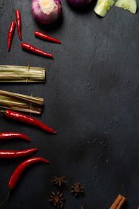 High angle view of red chili peppers on table