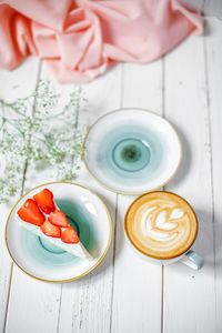 High angle view of coffee cup on table