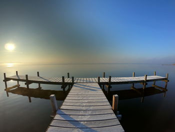 Pier over sea against sky