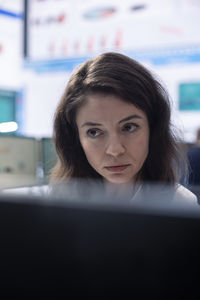 Portrait of young woman looking away