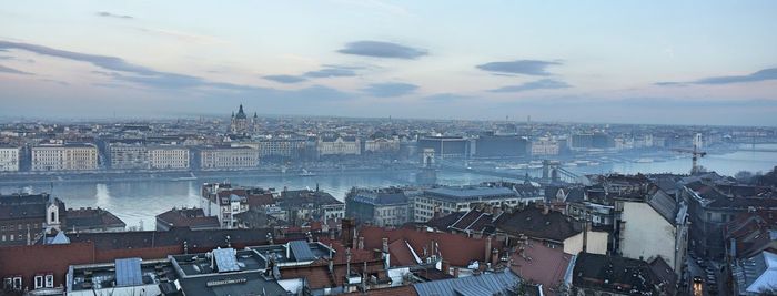 High angle view of city buildings during sunset