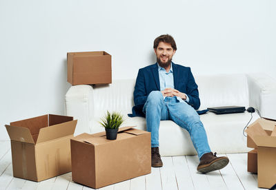 Portrait of smiling young man using mobile phone