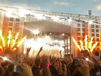 Rear view of people enjoying music concert