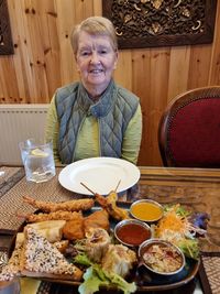 High angle view of young woman standing on table