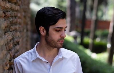 Portrait of young man looking away