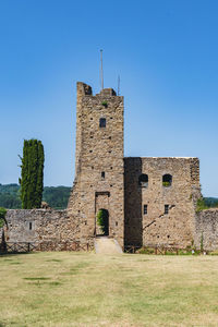 Low angle view of castle against clear blue sky