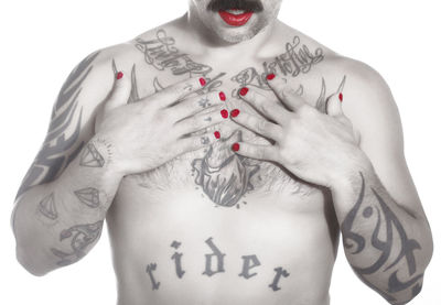 Midsection of shirtless man with text against white background