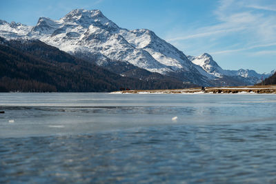 Switzerland, february 21, 2023 panorama with the lake of silvaplana and the mount corvatsch 