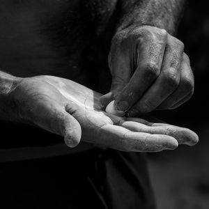 Close-up of hands holding chalk