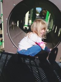 Rear view of girl playing in car