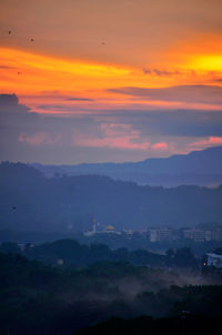 Scenic view of dramatic sky during sunset