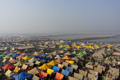 Rural scene with tents for living with river 