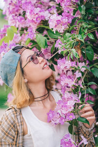 Close-up of beautiful woman with pink flowers