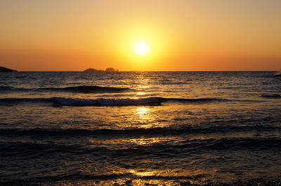 Scenic view of sea against sky during sunset