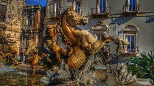 Low angle view of statues on building