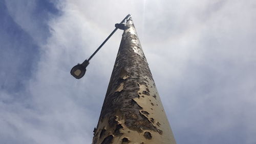 Low angle view of street light against sky