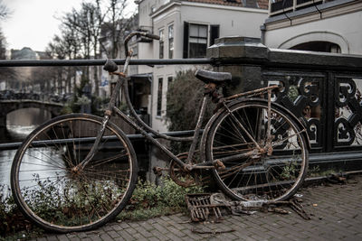 Bicycle parked by old building