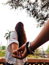 Women holding hand with love