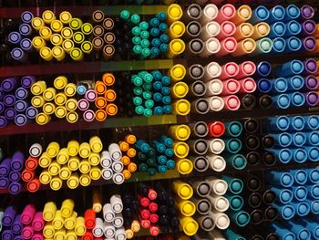 Full frame shot of colorful pens on shelves for sale