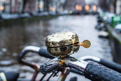 Close-up of wet bicycle on street during rainy season