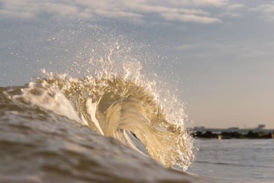 Close-up of sea waves splashing on shore