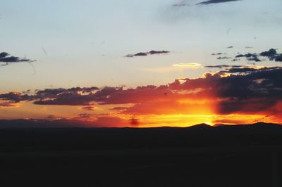 Scenic view of silhouette landscape against sky during sunset