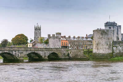 View of king john's castle and bridge from shannon river, limerick, ireland