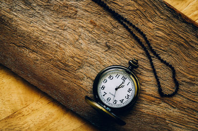 Close-up of clock on table