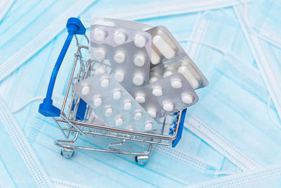 High angle view of shopping cart against white background