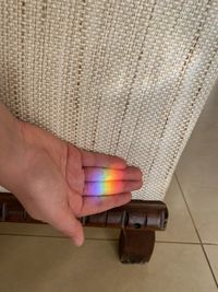 Midsection of person holding umbrella