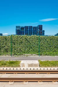 View of railroad tracks against blue sky