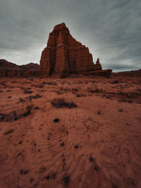 Rock formations on landscape against sky