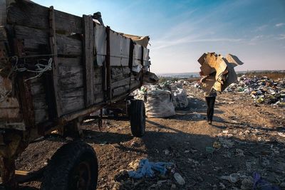 Stack of abandoned garbage against built structure