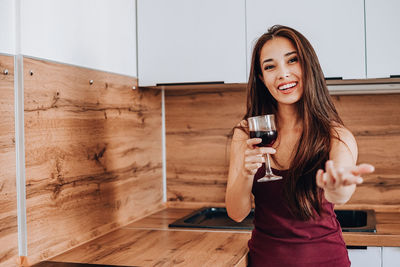 Young woman in a drinking glass