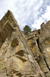 Low angle view of built structure against cloudy sky