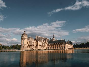 Historic building against cloudy sky