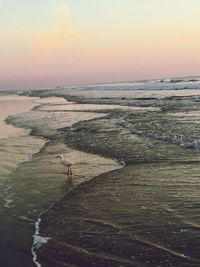 Scenic view of sea at sunset