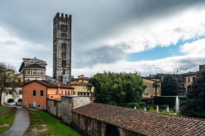 View of lucca historic center with the tower bell of the basilica of saint frediano, tuscany, italy