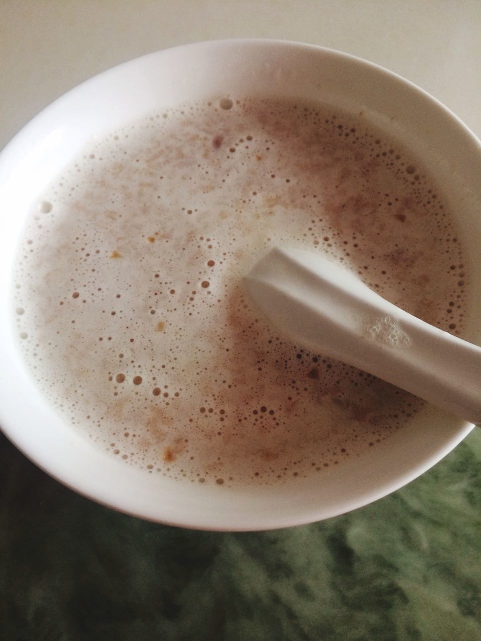 coffee cup, drink, food and drink, refreshment, coffee - drink, indoors, saucer, coffee, frothy drink, freshness, table, cappuccino, cup, still life, close-up, spoon, froth art, high angle view, beverage, latte