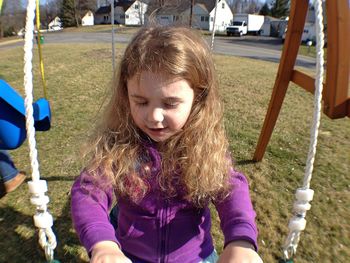 Full length of friends on grassy