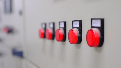 Close-up of red wine bottles on wall