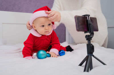 High angle view of cute baby girl playing with toy