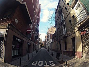 Narrow alley with buildings in background