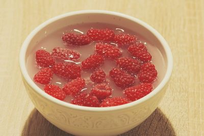 High angle view of strawberries in bowl on table