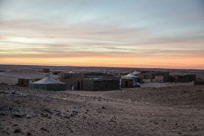 Built structure against sunset sky