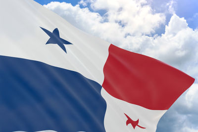 Low angle view of flag against sky